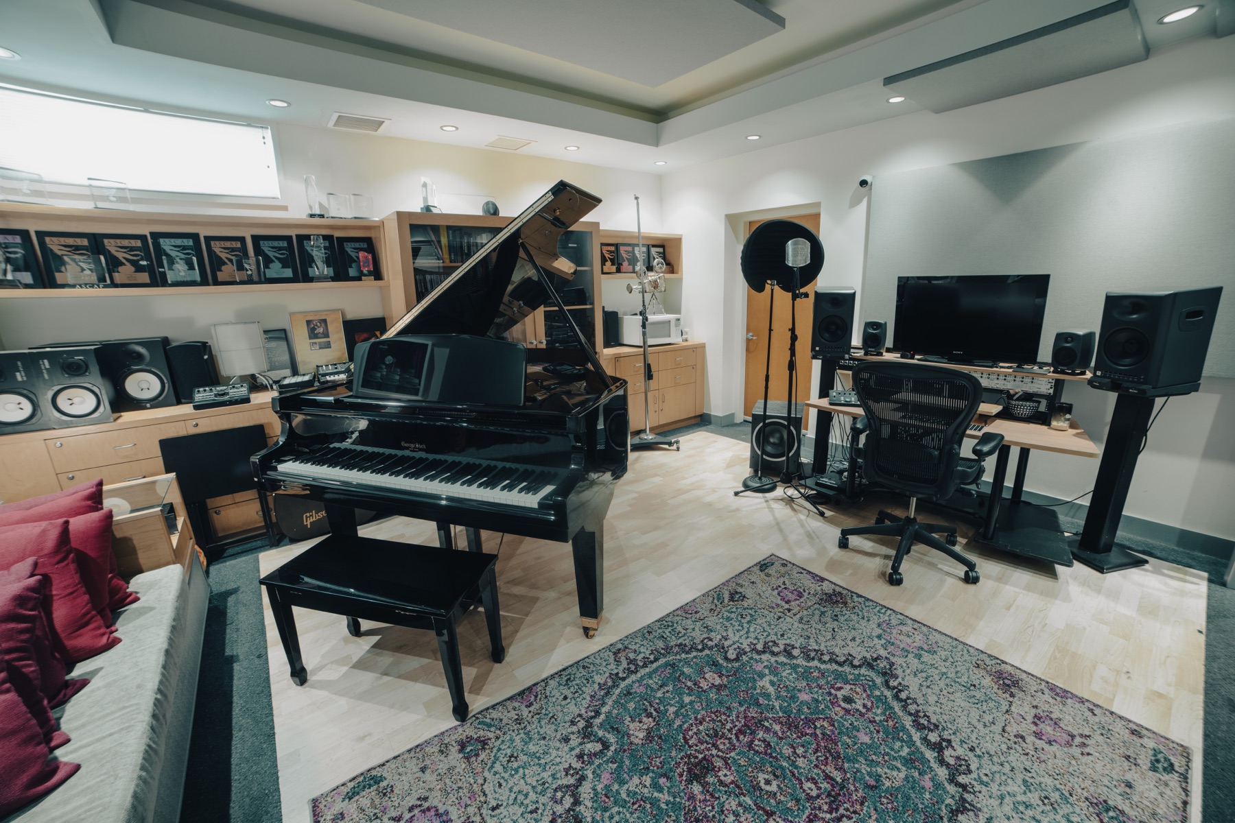 Red Dot piano room with grand piano